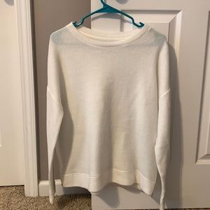 Oversized small, white sweater with zippers on both sides